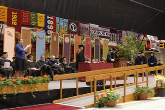 University President Dennison at Podium with George Kerscher to his right.